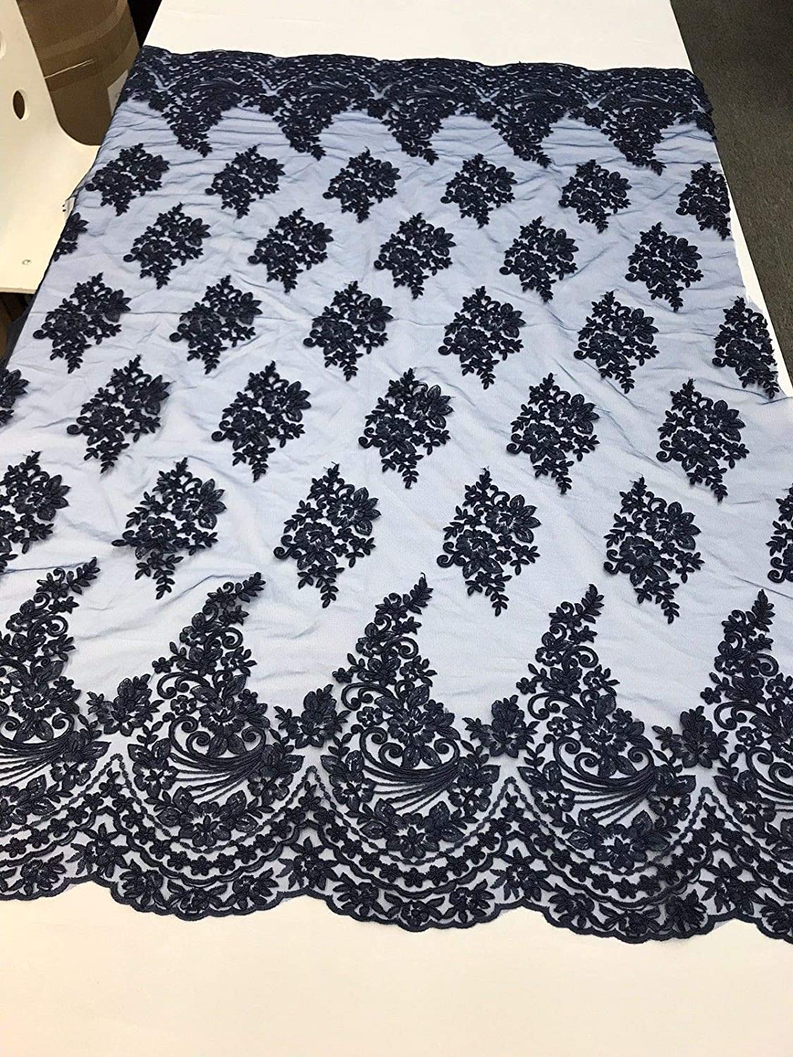 NAVY BLUE FLORAL DESIGN WITH CORD EMBROIDERY ON A MESH LACE-SOLD BY YARD.