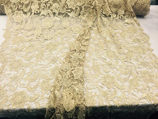 Facsinating gold light weight guipure design sold by the yard