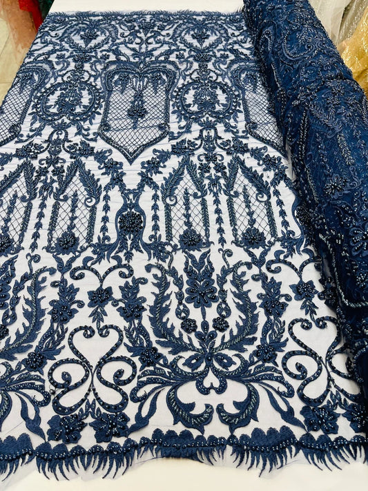 Navy blue diva design embroidery with heavy beaded on a mesh lace-sold by the yard.