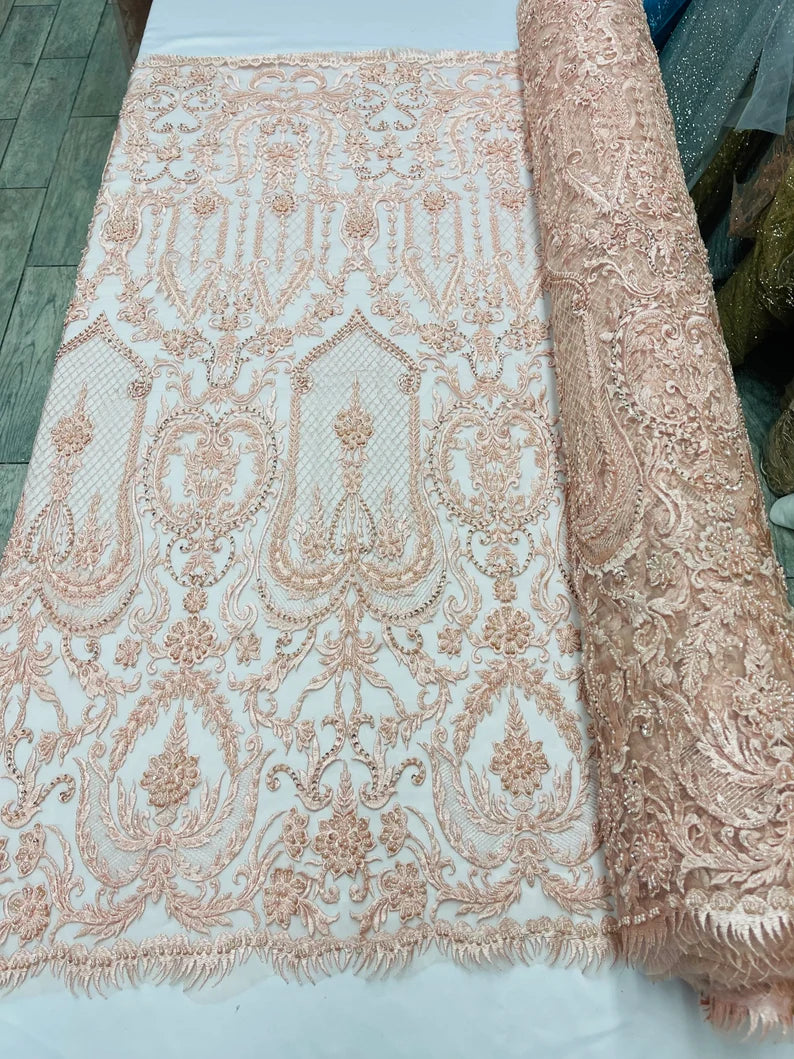 Blush Peach diva design embroidery with heavy beaded on a mesh lace-sold by the yard.