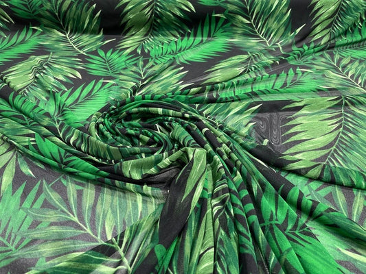 Green Leaf Design on a Black Power Mesh 4-way Stretch. Sold by Yard