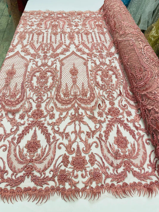 Dusty rose diva design embroidery with heavy beaded on a mesh lace-sold by the yard.