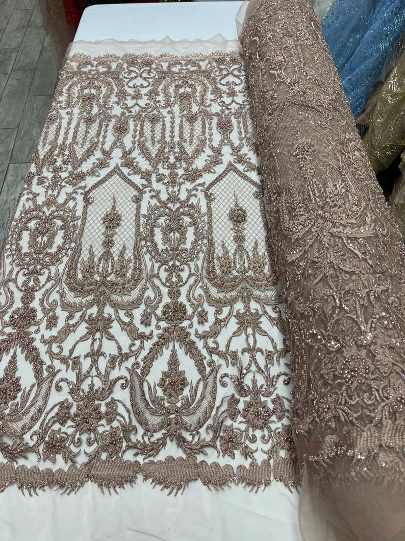 Rose gold diva design embroidery with heavy beaded on a mesh lace-sold by the yard.