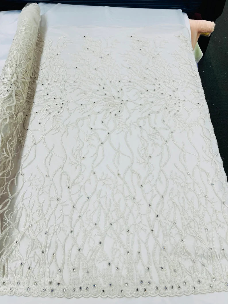 Off white Vine Design Embroider and heavy beading on a mesh lace-sold by the yard.
