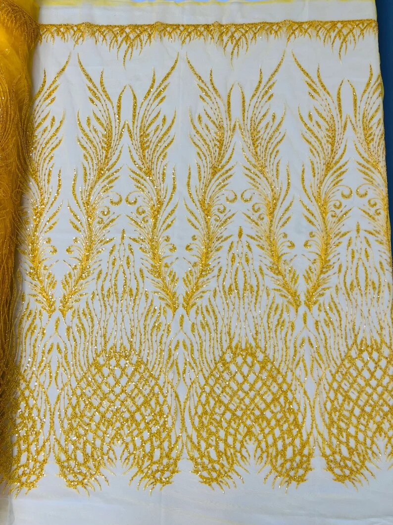 Wings Design Embroider and heavy beading on a mesh lace-sold by the yard. Dark Yellow