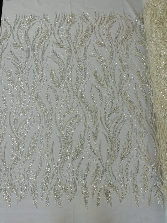 Festival Design Embroider and heavy beading on a mesh lace-sold by the yard. Off White/Clear