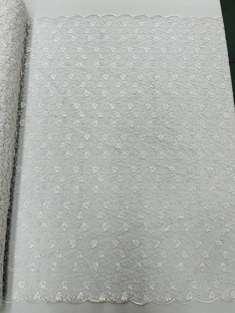 Corded flowers embroider with sequins on a mesh lace fabric-sold by the yard- White