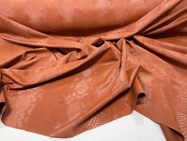 Illusion snake skin print on a stretch spandex-skirts-leggings-dresses-sold by the yard. Light Rust