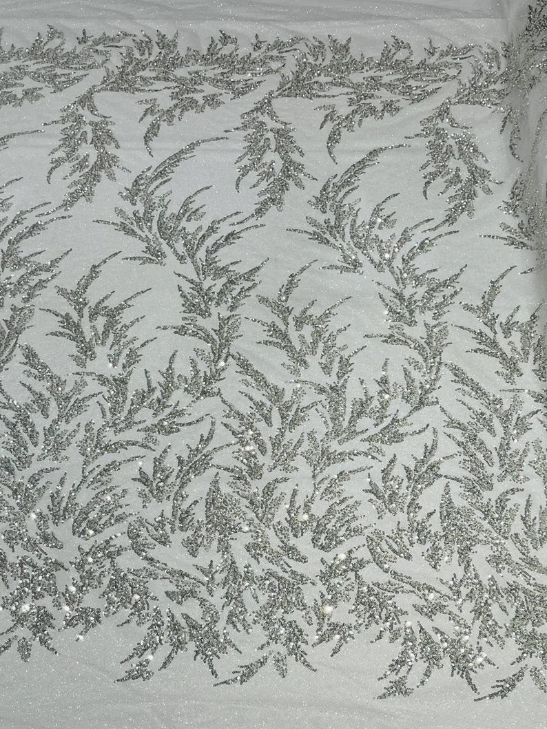 Elegant hand beaded design embroider on a glitter mesh lace-prom-sold by the yard. Silver/White