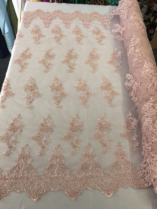 LIGHT PINK HAND BEADED FLORAL DESIGN EMBROIDERY ON A MESH LACE-SOLD BY YARD.