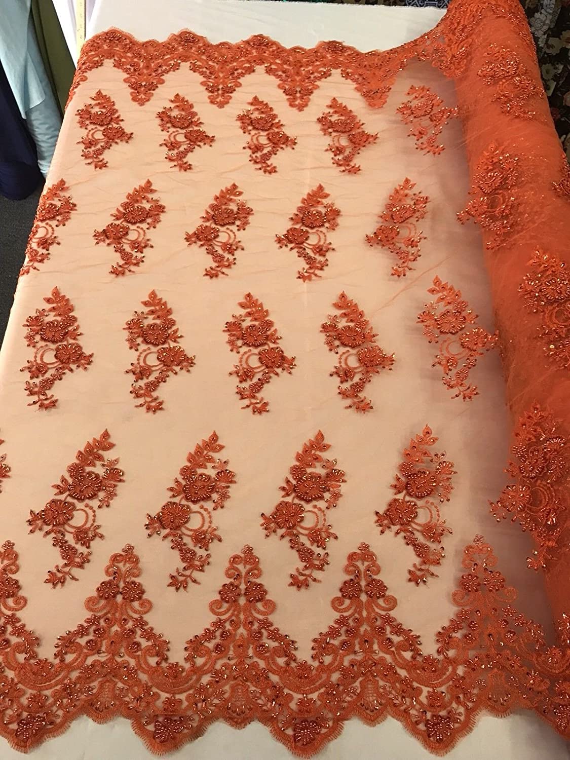 DEEP ORANGE HAND BEADED FLORAL DESIGN EMBROIDERY ON A MESH LACE-SOLD BY YARD.