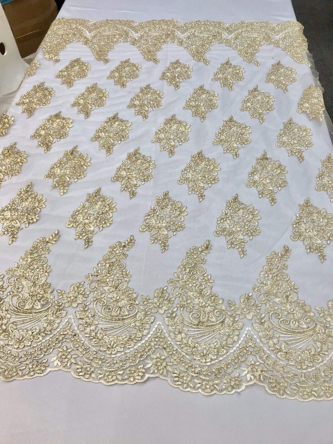 METALLIC LT-GOLD FLORAL DESIGN WITH CORD EMBROIDERY ON A MESH LACE-SOLD BY YARD.