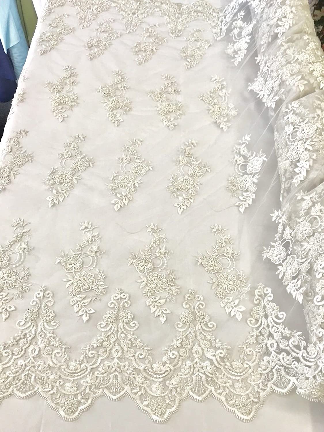 DIAMOND WHITE HAND BEADED FLORAL DESIGN EMBROIDERY ON A MESH LACE-SOLD BY YARD.