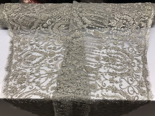 SILVER METALLIC DIVA DESIGN EMBROIDERY WITH HEAVY BEADED ON A MESH-SOLD BY YARD.