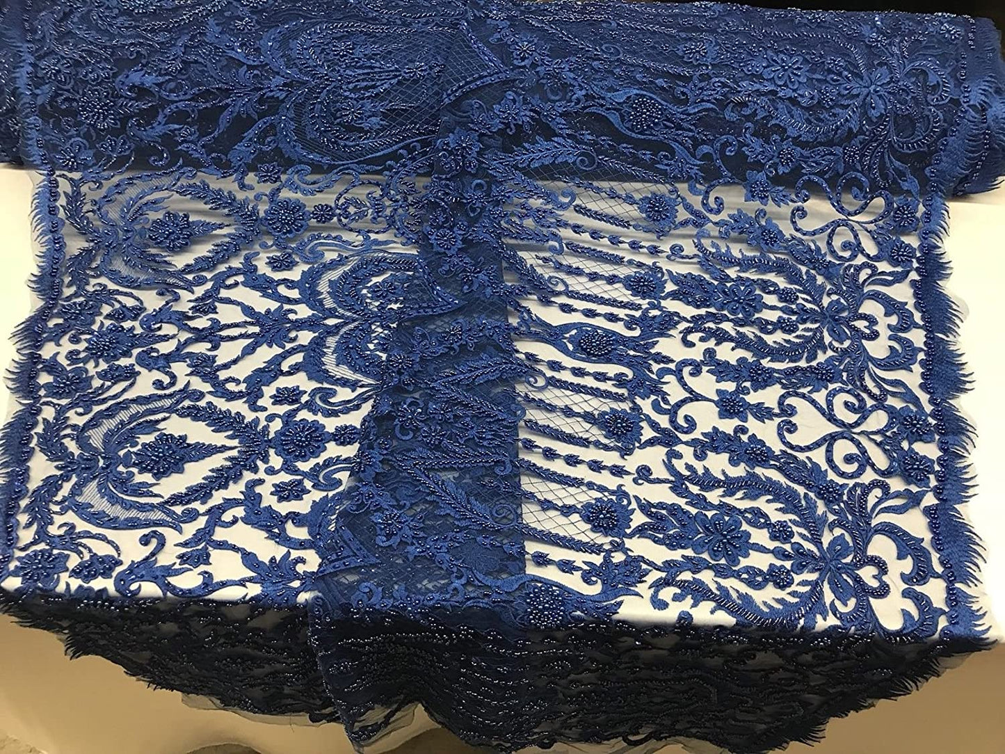 ROYAL BLUE DIVA DESIGN EMBROIDERY WITH HEAVY BEADED ON A MESH-SOLD BY YARD.