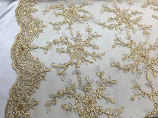 Champagne/gold snowflake flower design embroider with sequins on a mesh lace. bridal/prom/nightgown fabric sold by the yard