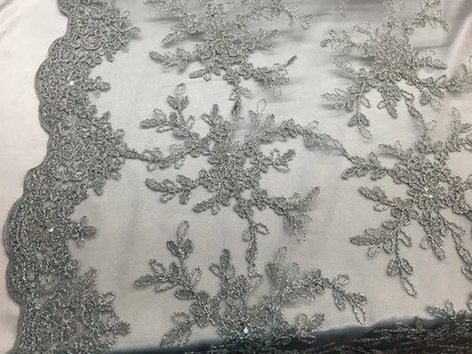 Gray/silver snowflake flower design embroider with sequins on a mesh lace. bridal/prom/nightgown fabric sold by the yard