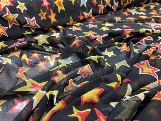 Star Design on a Black Power Mesh 4-way stretch 58"-Sold by the Yard