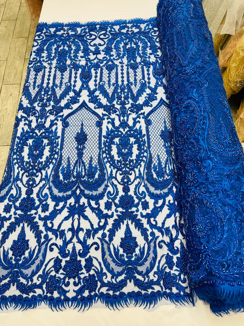 Royal blue diva design embroidery with heavy beaded on a mesh lace-sold by the yard.