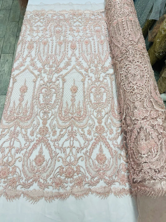 Blush Pink diva design embroidery with heavy beaded on a mesh lace-sold by the yard.