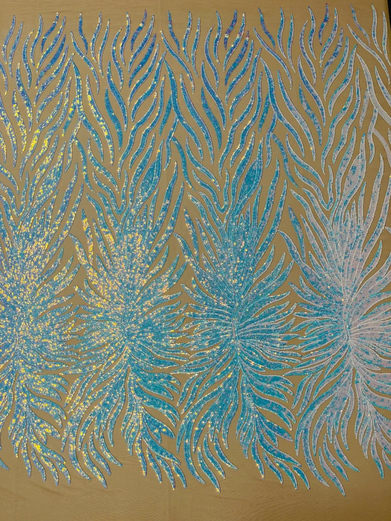Aqua iridescent phoenix feather design with sequins embroider on a Nude 4 way stretch mesh fabric-sold by the yard.