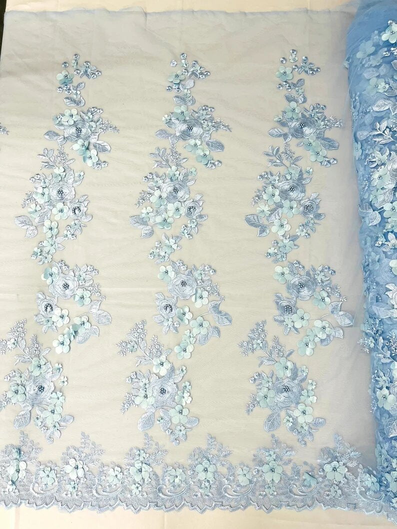 3D floral design embroider with pearls in a mesh lace-sold by the yard. Light Blue