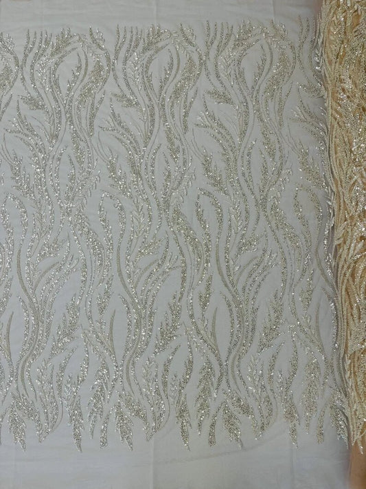 Festival Design Embroider and heavy beading on a mesh lace-sold by the yard. Nude/Clear