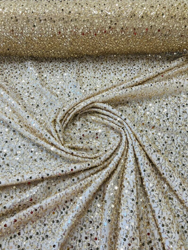 Royalty Fabrics Light Gold iridescent heavy hand beaded princess design embroider with beads-pearls-sequins on a mesh lace-sold by yard.