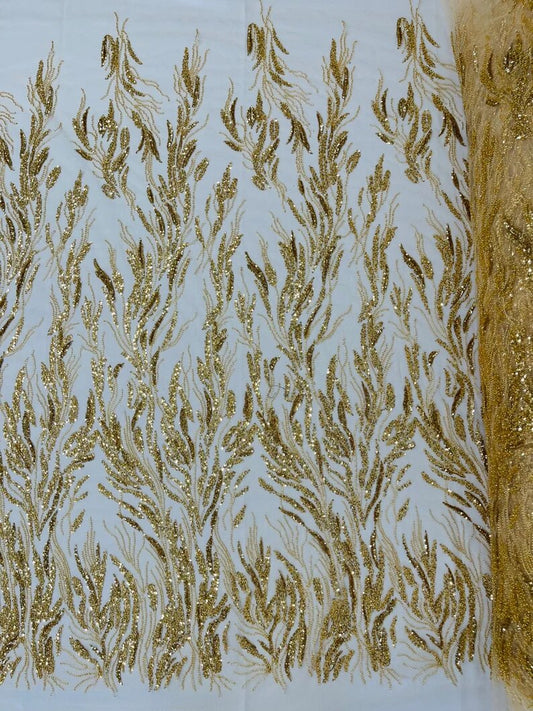 Fancy Design Embroider and heavy beading on a mesh lace-sold by the yard. Gold