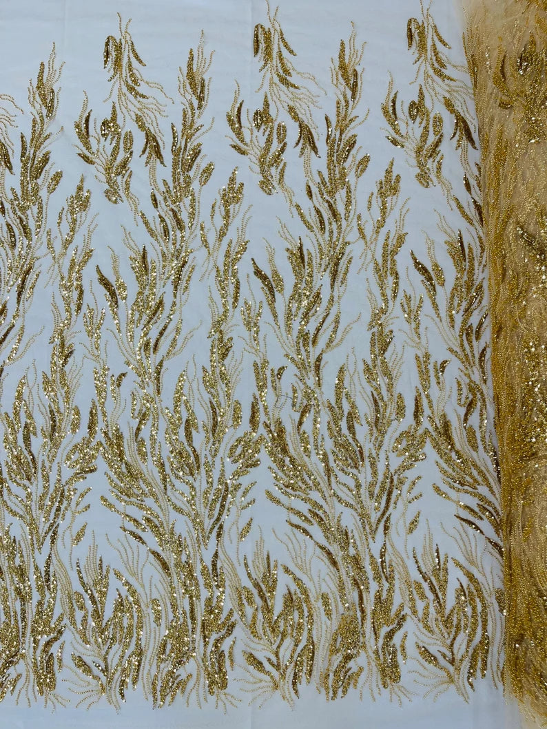 Fancy Design Embroider and heavy beading on a mesh lace-sold by the yard. Gold