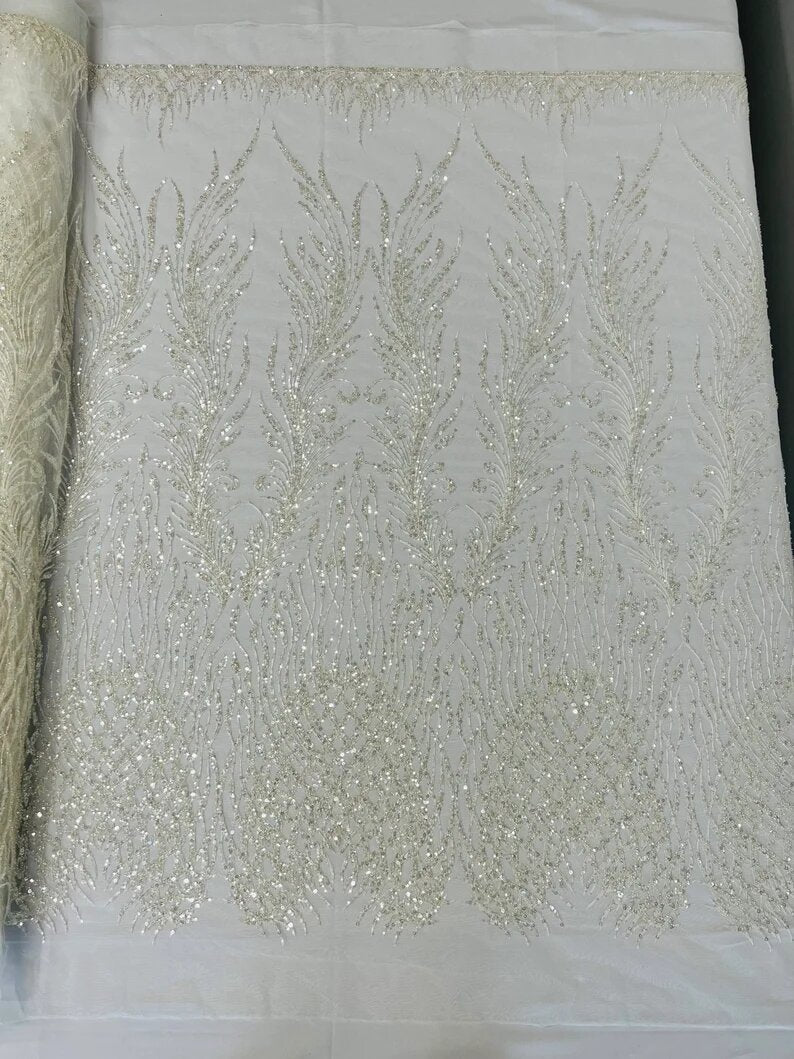 Wings Design Embroider and heavy beading on a mesh lace-sold by the yard. Off White