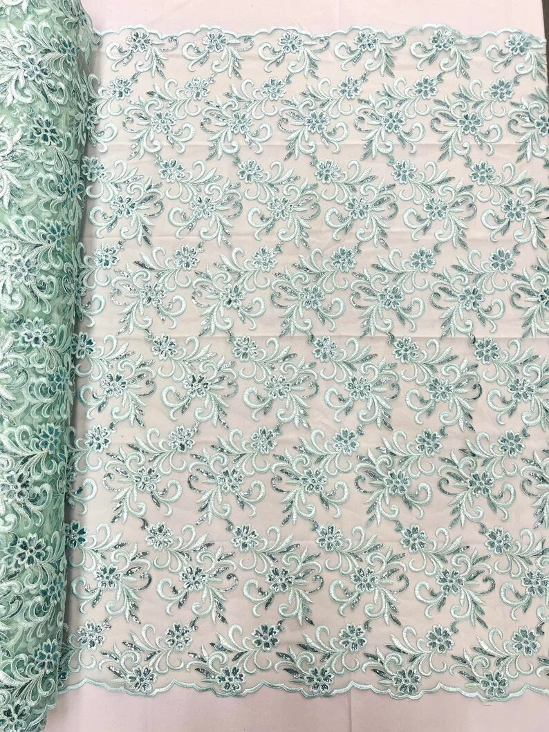 Corded flowers embroider with sequins on a mesh lace fabric-sold by the yard- Mint