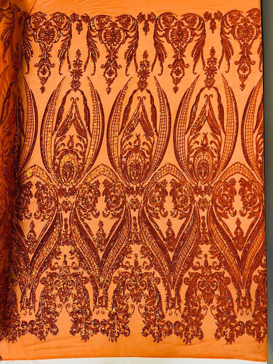 Empire damask design with sequins embroider on a 4 way stretch mesh fabric-sold by the yard. Burnt Orange