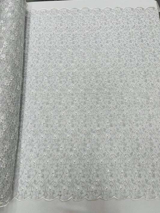 Corded flowers embroider with sequins on a mesh lace fabric-sold by the yard- Silver/White